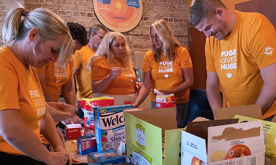 Team preparing snack and laundry packs